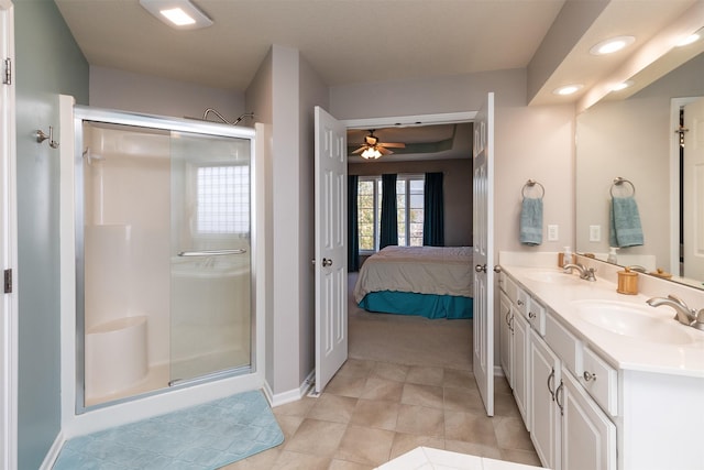 bathroom with an enclosed shower, vanity, and ceiling fan