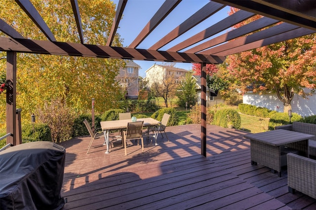 deck with a water view, a pergola, and grilling area