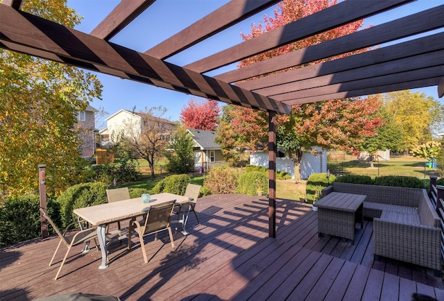 deck with an outdoor hangout area and a pergola