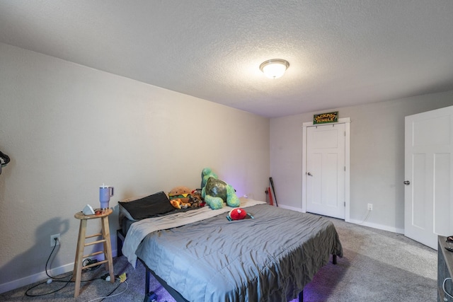 carpeted bedroom with a textured ceiling