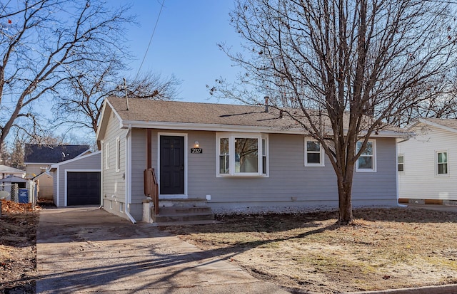 view of front of house with an outdoor structure and a garage