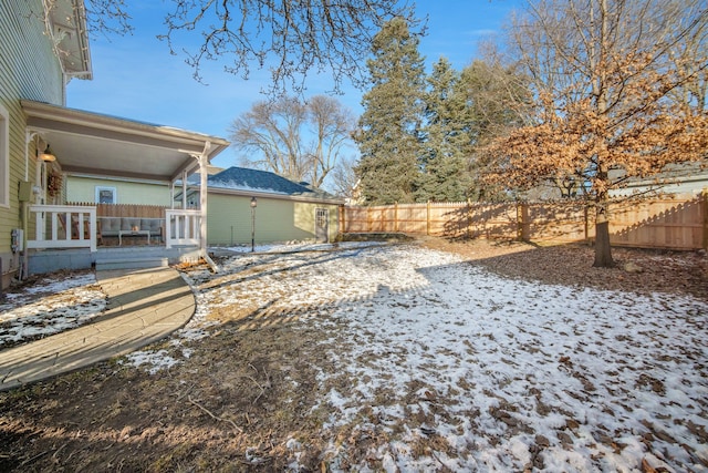 view of yard layered in snow