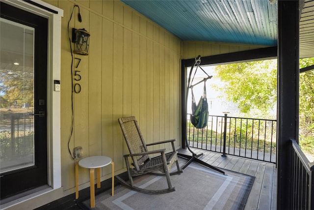 wooden deck featuring covered porch