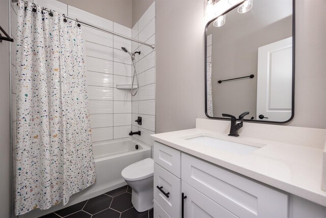 full bathroom featuring tile patterned floors, toilet, vanity, and shower / bath combination with curtain