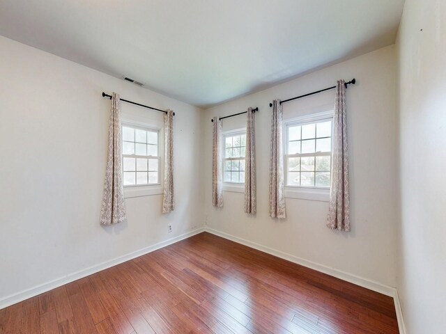 unfurnished room featuring wood-type flooring