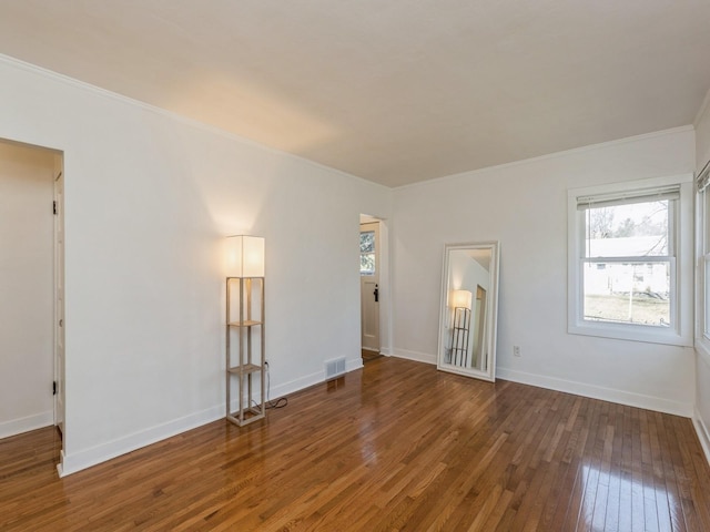 unfurnished room with hardwood / wood-style floors