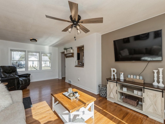 living room with ceiling fan and wood-type flooring