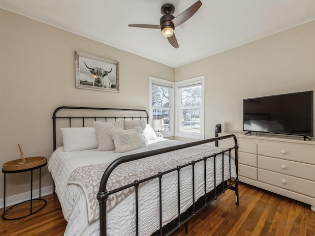 bedroom featuring ceiling fan and dark hardwood / wood-style flooring