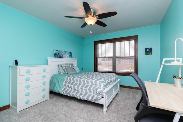 bedroom featuring ceiling fan and light colored carpet