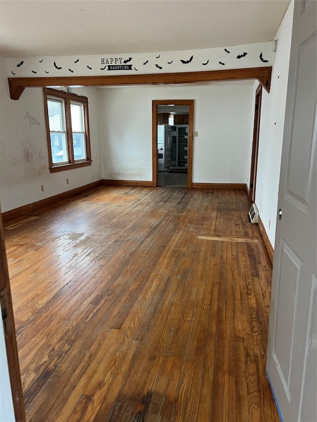 empty room featuring wood-type flooring