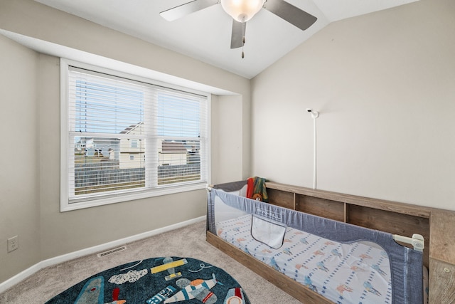 carpeted bedroom featuring ceiling fan and lofted ceiling