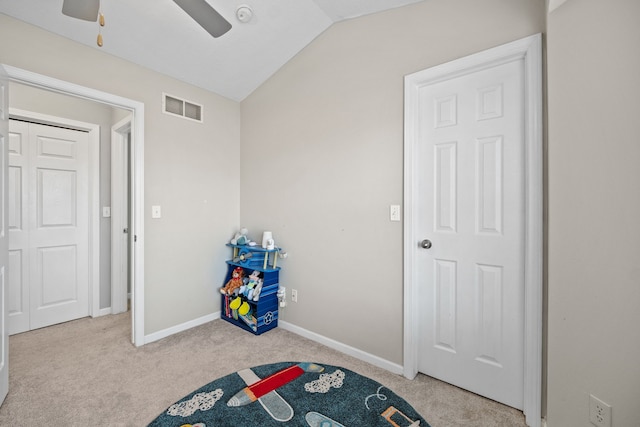 carpeted bedroom with lofted ceiling and ceiling fan