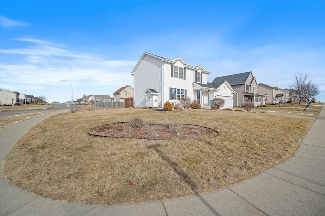 view of front facade with a garage and a front yard