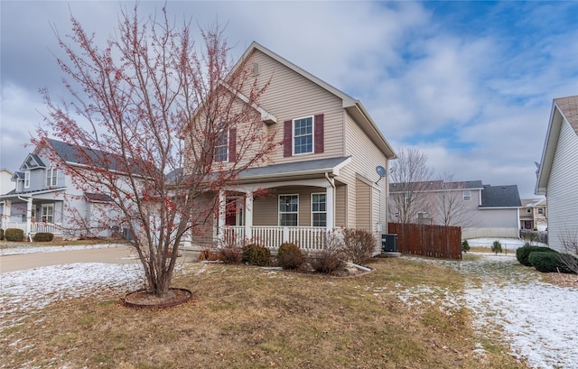 front of property featuring a porch, a yard, and central air condition unit