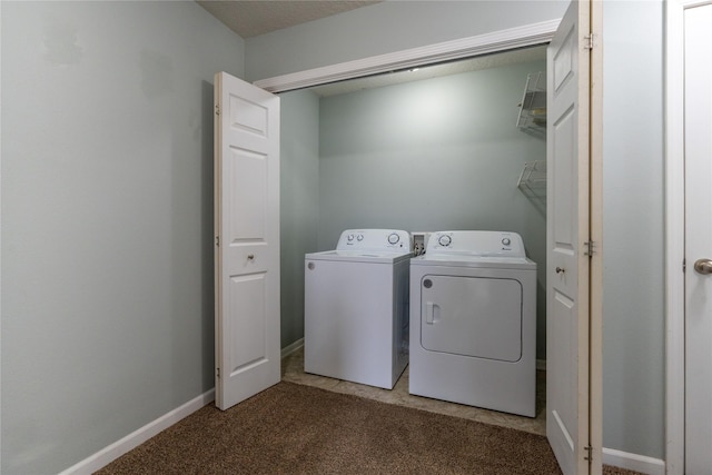 laundry area featuring carpet floors and washing machine and clothes dryer