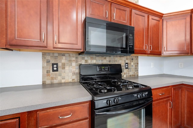 kitchen featuring black appliances and tasteful backsplash