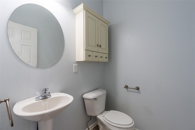 bathroom with toilet and sink