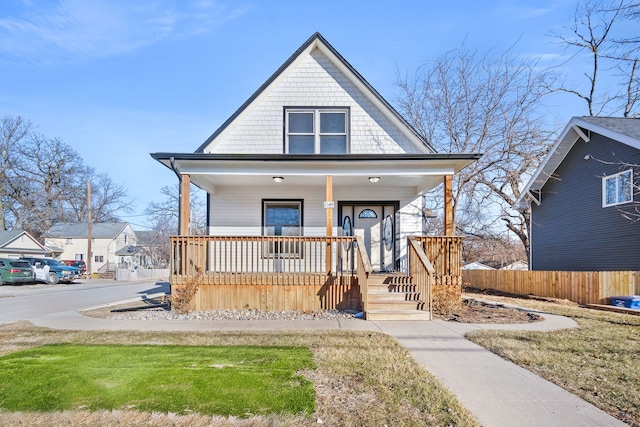 view of front facade with a porch and a front yard