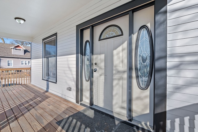 view of exterior entry featuring a porch