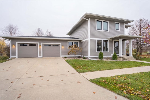 view of front facade with a garage and a front yard