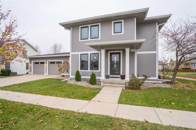 view of front facade featuring a front yard and a garage