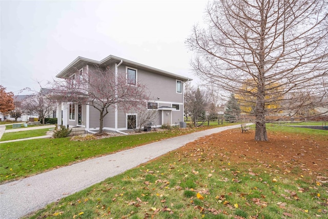 view of home's exterior with a yard