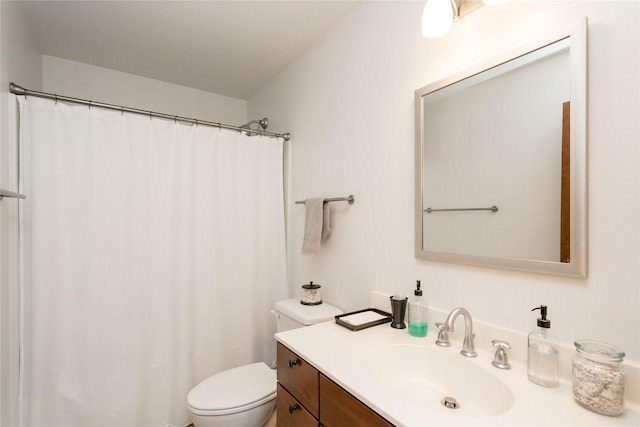 bathroom with toilet and vanity