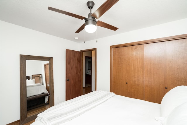 bedroom with ceiling fan and a closet