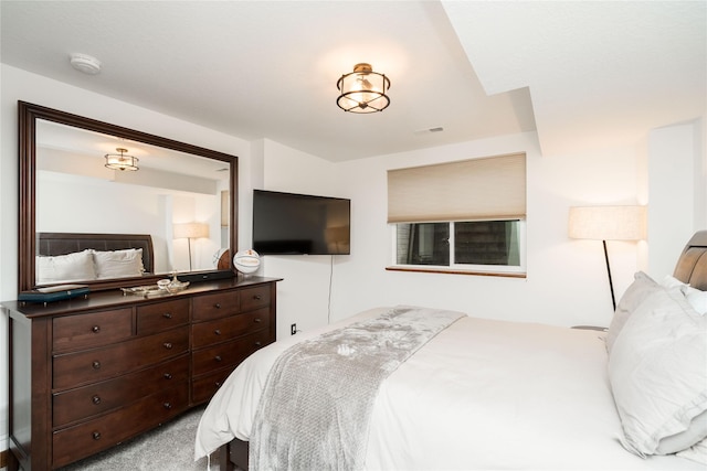 bedroom featuring light colored carpet