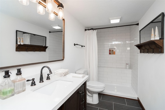 bathroom with toilet, vanity, tile patterned flooring, and a shower with shower curtain