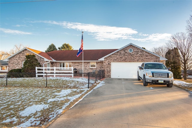 single story home with a garage