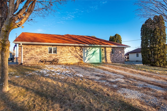 back of property with a garage