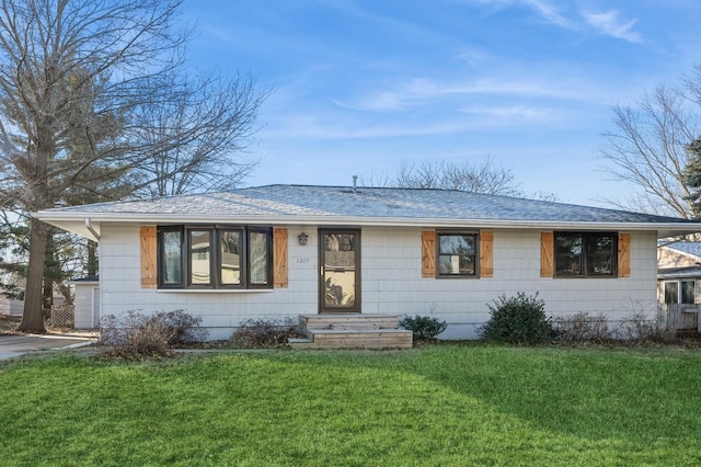 ranch-style home with a front lawn