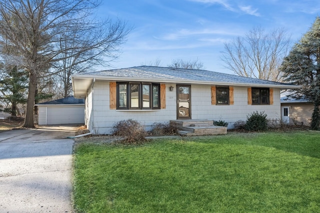 single story home featuring a garage and a front yard