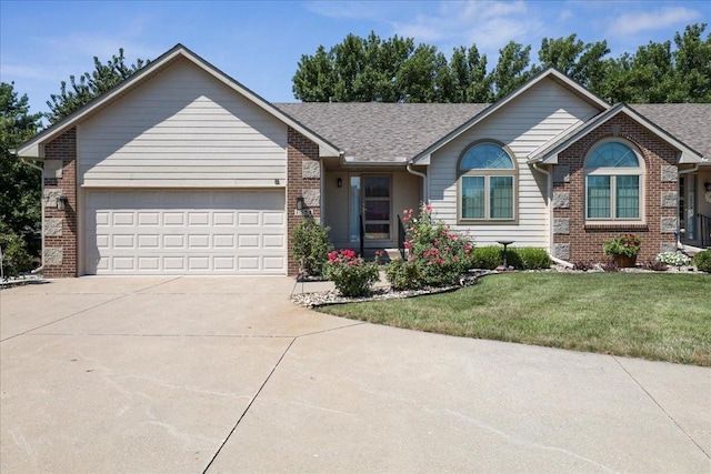 ranch-style home featuring a front yard and a garage