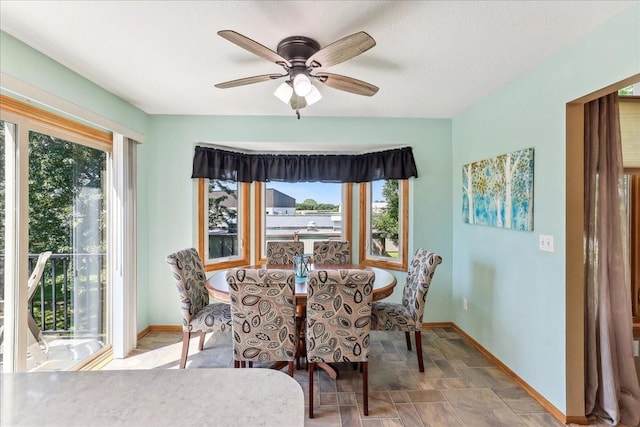 dining room featuring ceiling fan