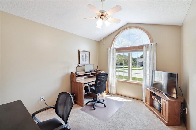 office area with ceiling fan, light colored carpet, a textured ceiling, and lofted ceiling