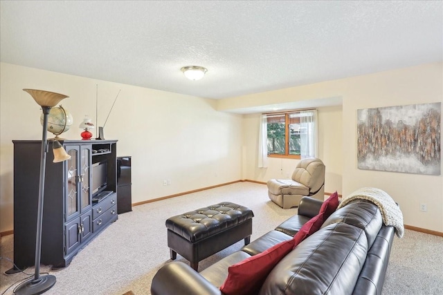 carpeted living room featuring a textured ceiling