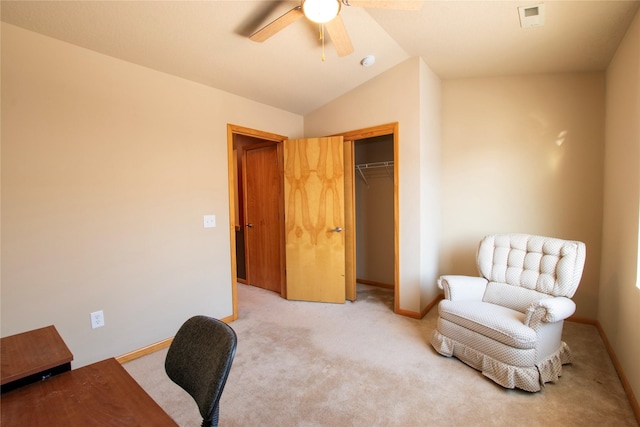 sitting room with ceiling fan, light colored carpet, and lofted ceiling