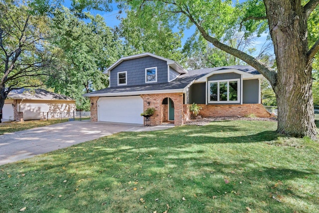 tri-level home featuring a garage and a front yard