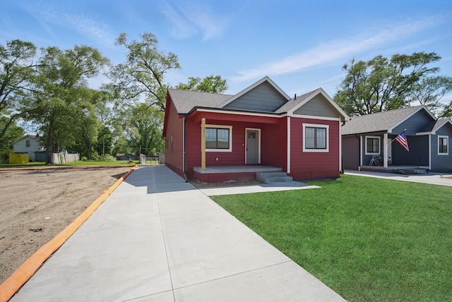 2527 Shaw St, Des Moines, IA 50317 - view of front of house featuring a porch, a front lawn, and concrete driveway