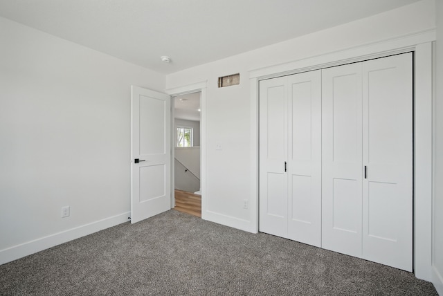 2527 Shaw St, Des Moines, IA 50317 - unfurnished bedroom with carpet floors, baseboards, and a closet