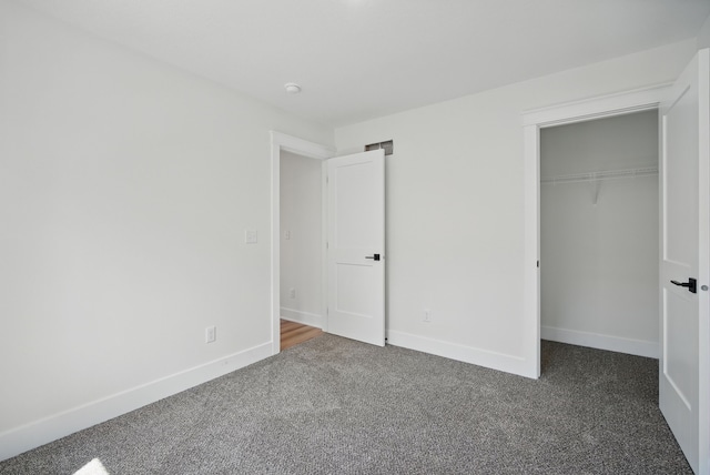 2527 Shaw St, Des Moines, IA 50317 - unfurnished bedroom with carpet flooring, baseboards, and a closet
