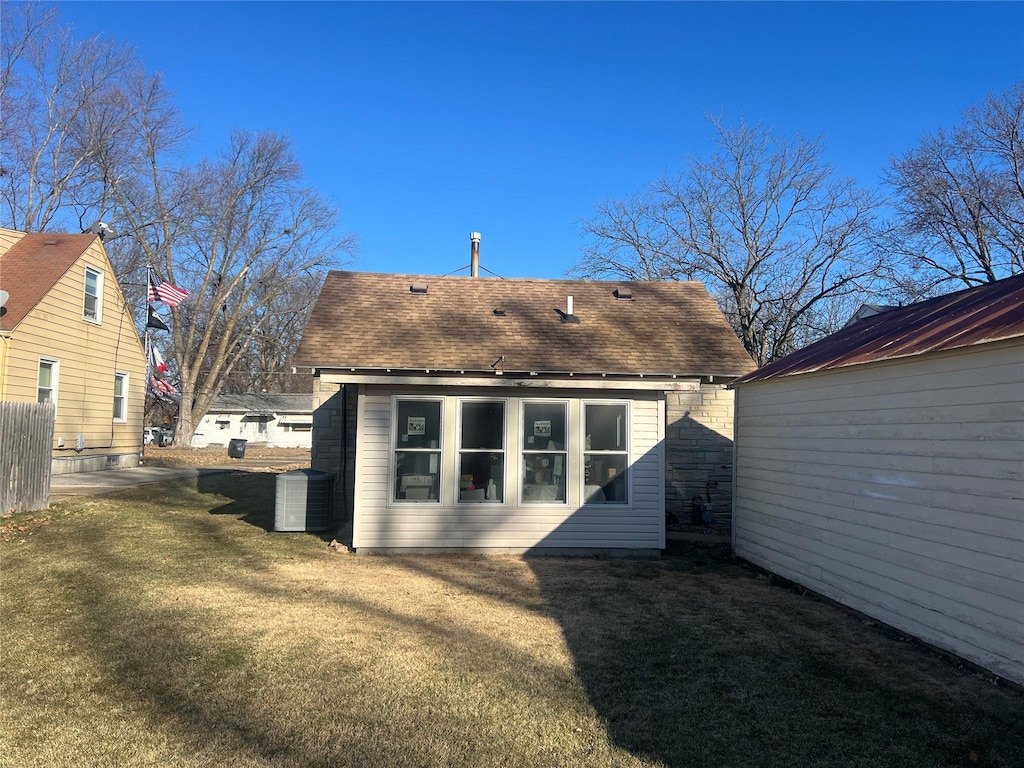 back of house with a yard