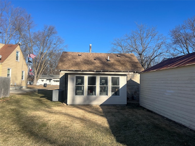 back of house with a yard