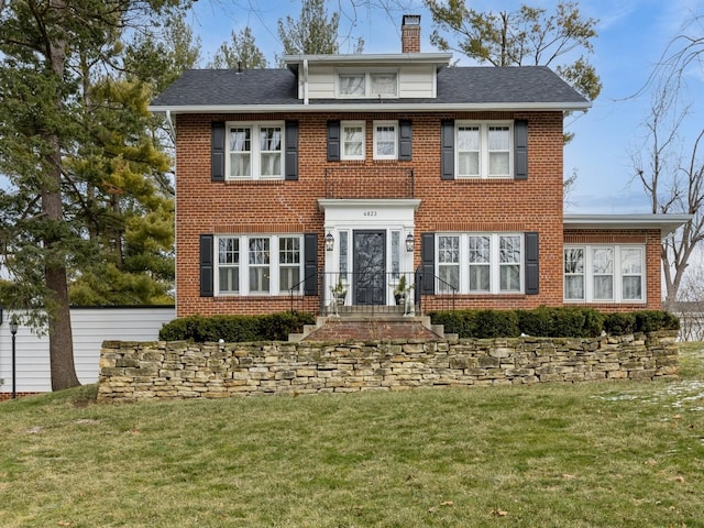 colonial inspired home with a front yard