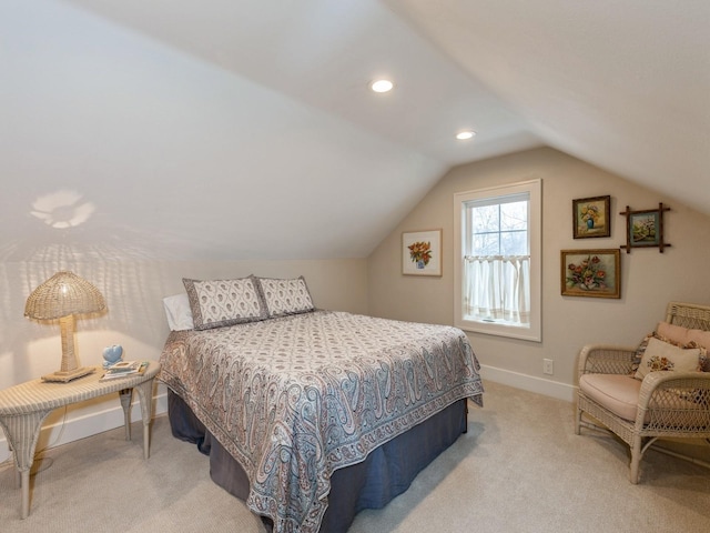 bedroom featuring light carpet and vaulted ceiling