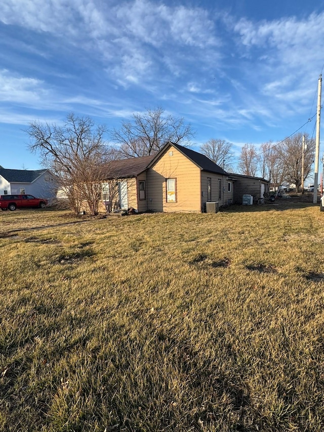 view of home's exterior with a yard