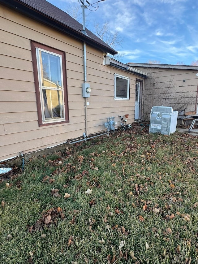 view of home's exterior with a yard