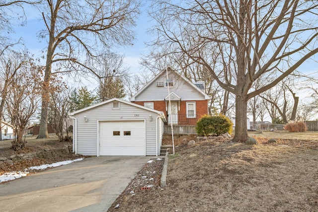 view of front of property with a garage and an outdoor structure